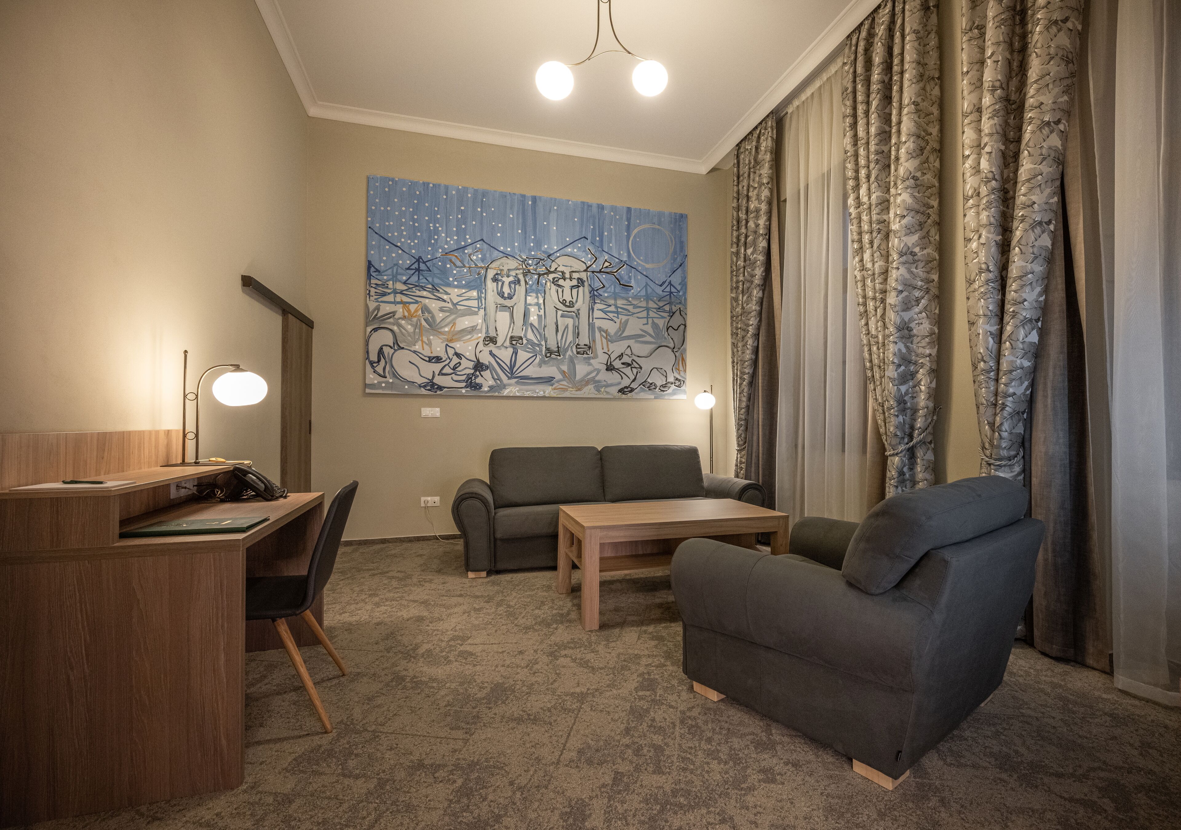 deluxe junior suite (spa access) | living area | flat-screen tv, heated floors