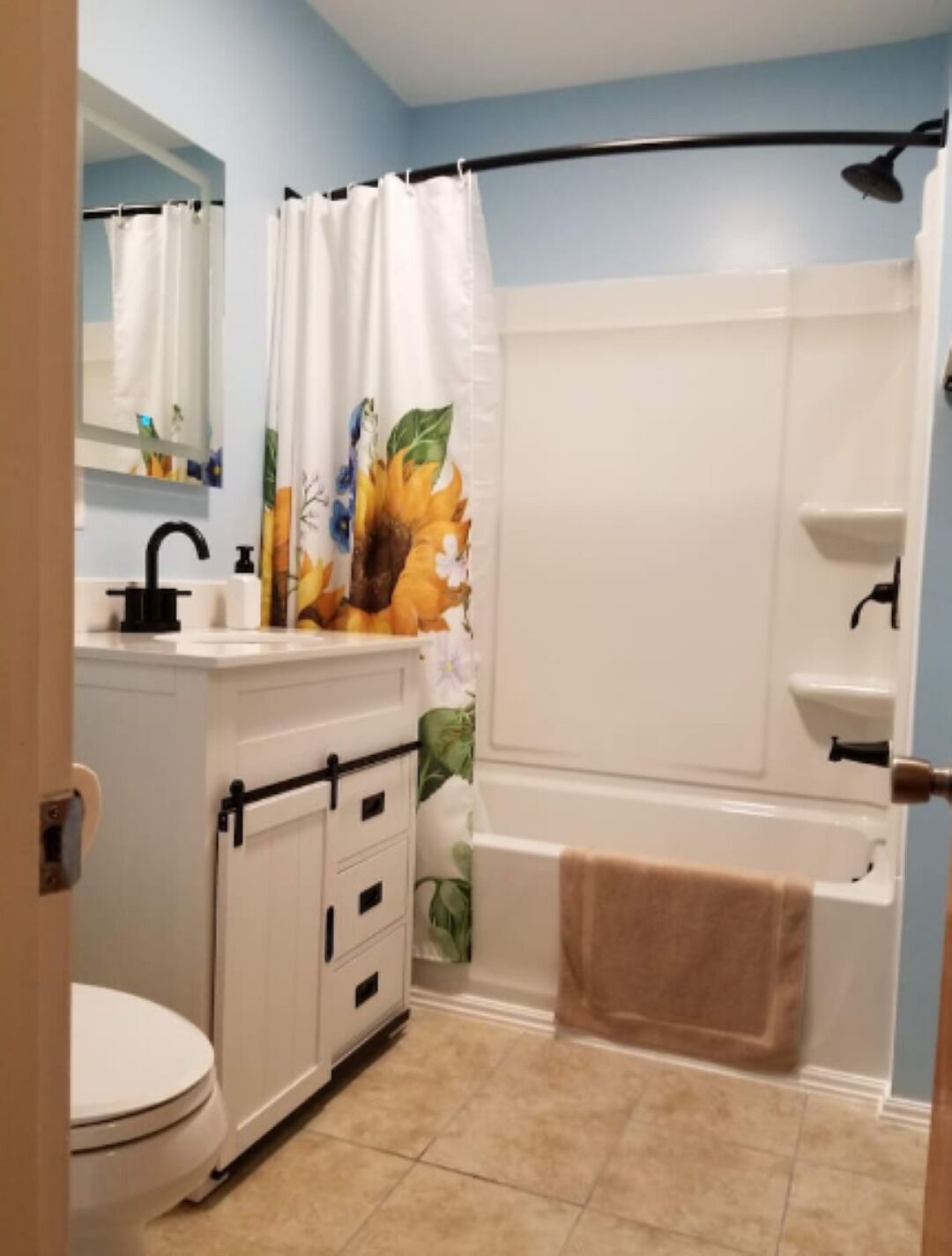 Combined shower/tub, hair dryer, towels, soap