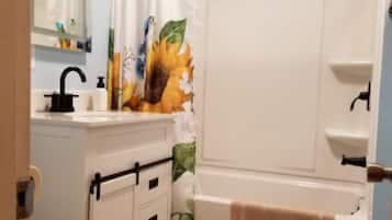 Combined shower/tub, hair dryer, towels, soap