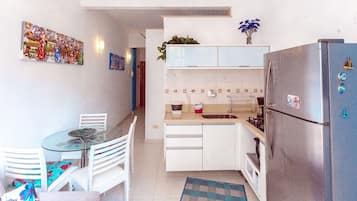 Fridge, microwave, cookware/dishes/utensils