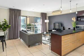 Grand Apartment | Living area | 32-inch flat-screen TV with satellite channels, TV, Netflix - Icon 407 (Cape Town)