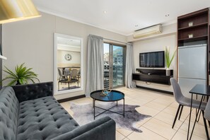 Premier Apartment | Living area | 32-inch flat-screen TV with satellite channels, TV, Netflix - Icon 1402 (Cape Town)