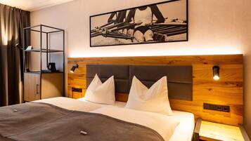 Premium bedding, desk, laptop workspace, blackout drapes