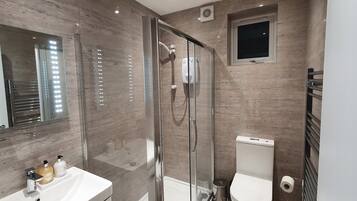 Shower, hair dryer, towels, soap