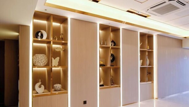 A modern hotel room with built-in wooden shelving units, each containing decorative items and a small clock. - Lavande Hotel (Zhuhai Gongbei Port Plaza Light Rail Terminal Store) (Zhuhai)