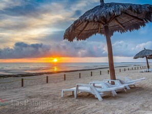 On the beach, sun-loungers, beach towels