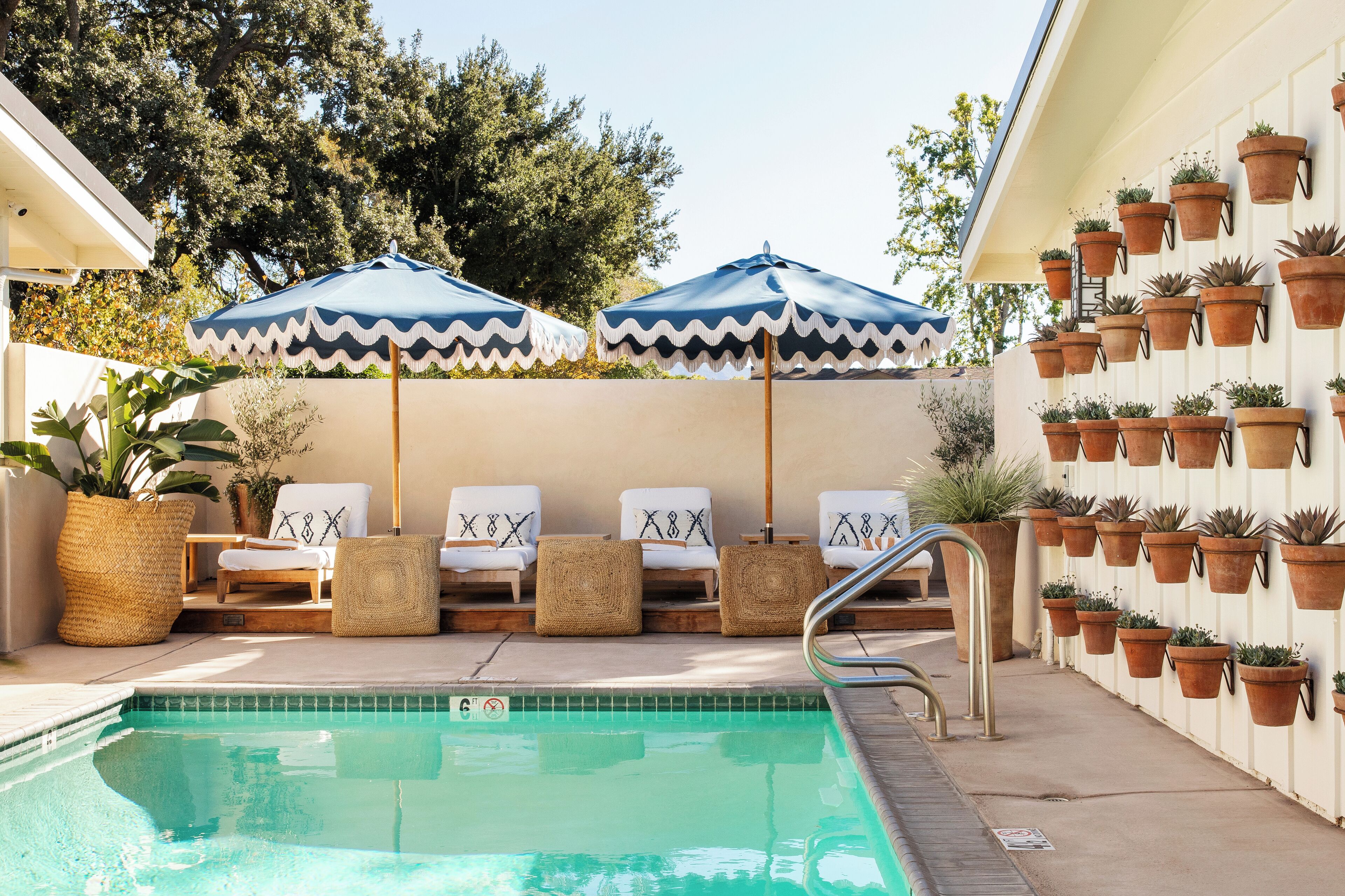 outdoor pool, open 9:00 am to 9:00 pm, pool umbrellas, pool loungers