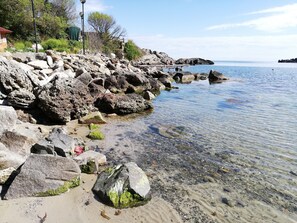 On the beach, sun-loungers