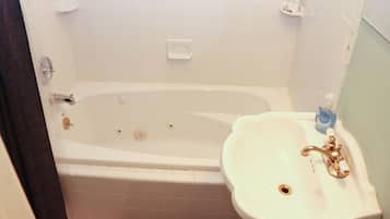 Combined shower/tub, hair dryer, towels, soap