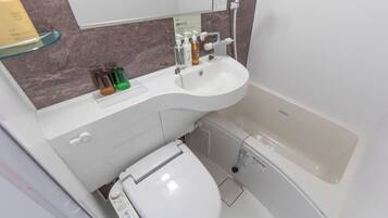 Combined shower/tub, free toiletries, hair dryer, slippers