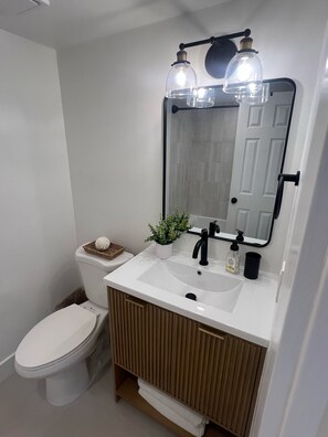 Combined shower/tub, hair dryer, towels, soap