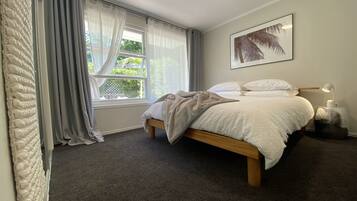 2 bedrooms, blackout curtains, iron/ironing board, travel cot