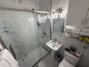 Shower, hair dryer, towels, soap
