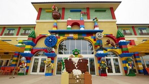 A colorful building with a large window and a LEGO-like facade. - Legoland Hotel (Carlsbad)