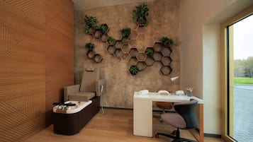 Work in comfort with a dedicated desk and ergonomic chair, surrounded by natural views and lush greenery.