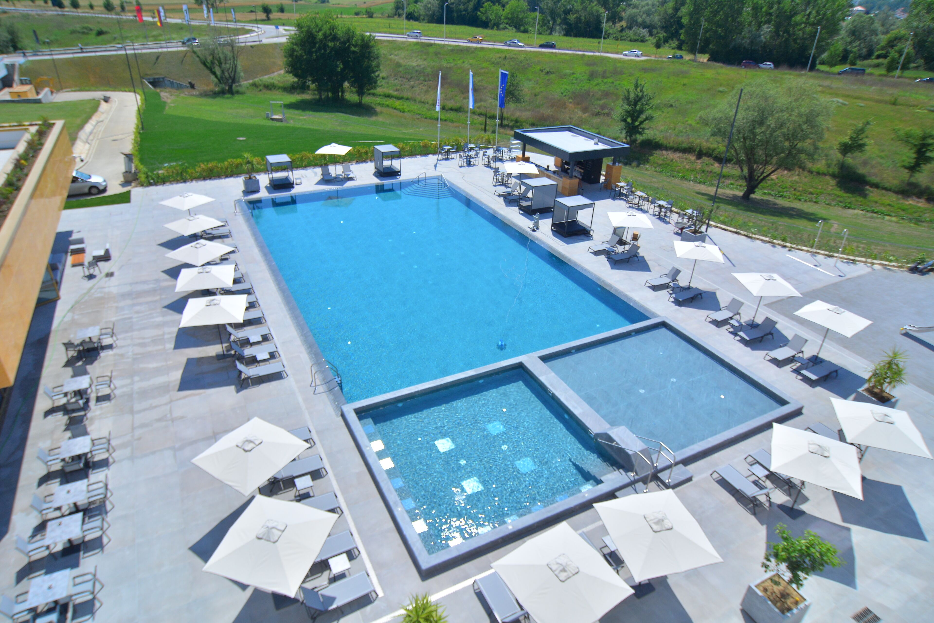 outdoor pool, open 7:00 am to 7:00 pm, pool umbrellas, pool loungers
