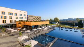 Outdoor pool, open 7:00 AM to 7:00 PM, pool umbrellas, pool loungers