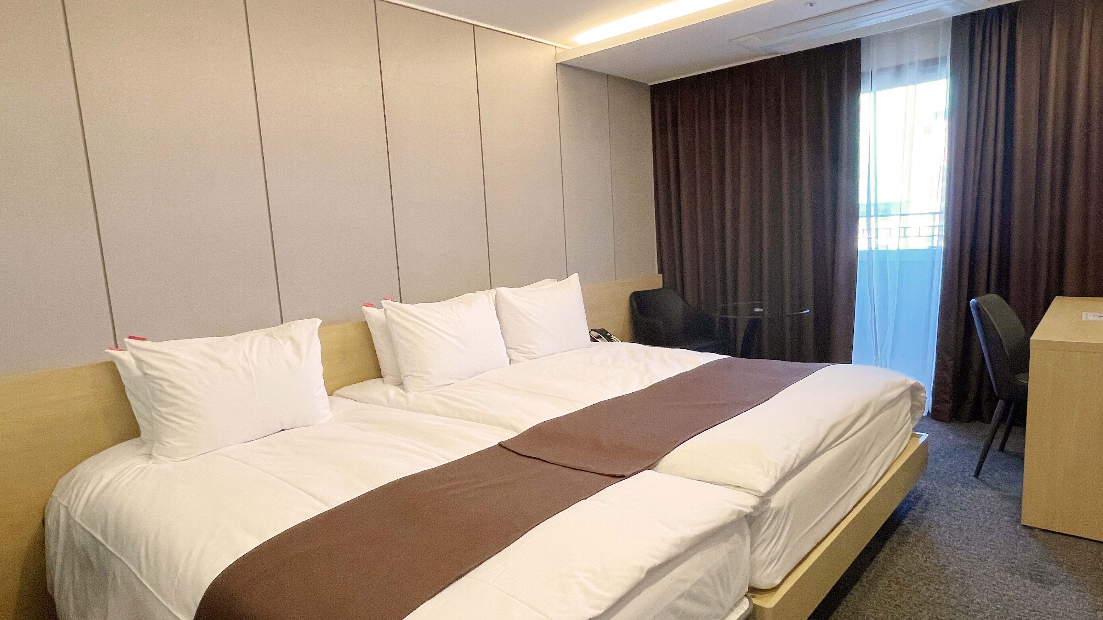 family double room | down duvets, desk, laptop workspace, blackout curtains