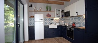 Picturesquely situated thatched-roof house in a large park-like garden