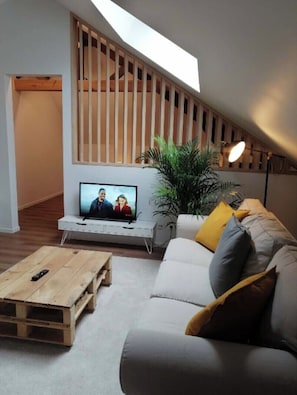 Apartment, 1 Bedroom, Terrace, Garden View | Living area | Flat-screen TV, books
