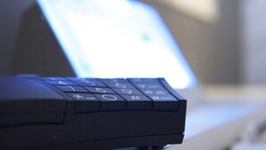 A close-up of a laptop keyboard with a blurred screen in the background. - Jyubankan - Adults Only (Yokohama)