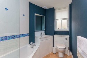 Bathtub, hair dryer, towels