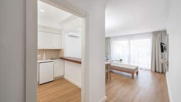 Fridge, microwave, stovetop, coffee/tea maker