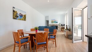 A modern living room with a dining area, a sofa, and a fireplace. - CA NA MENUDA - Cosy country house with private pool in quiet surroundings. Free WiFi (Sencelles)