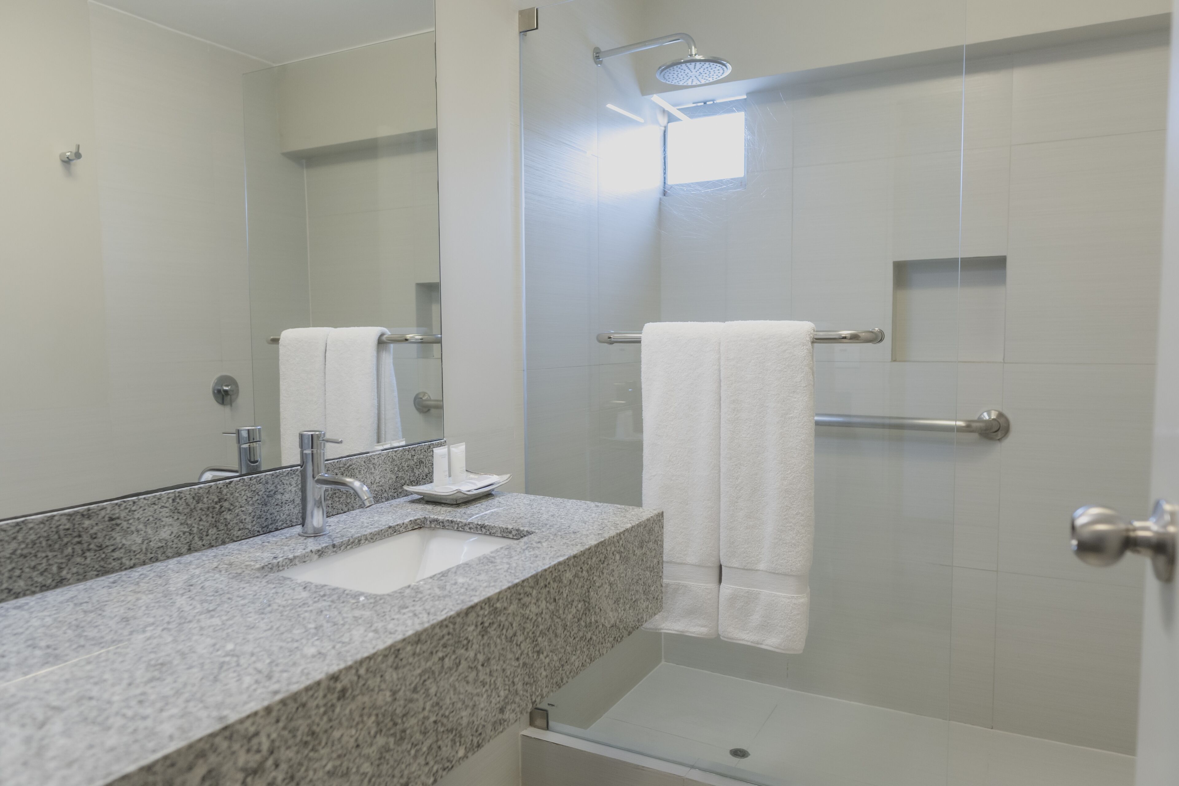 premium double room | bathroom | shower, rainfall showerhead, hair dryer, towels