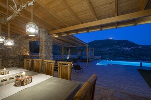 Outdoor pool, an infinity pool - Modern country villa with stone-built BBQ area (Lefkada)