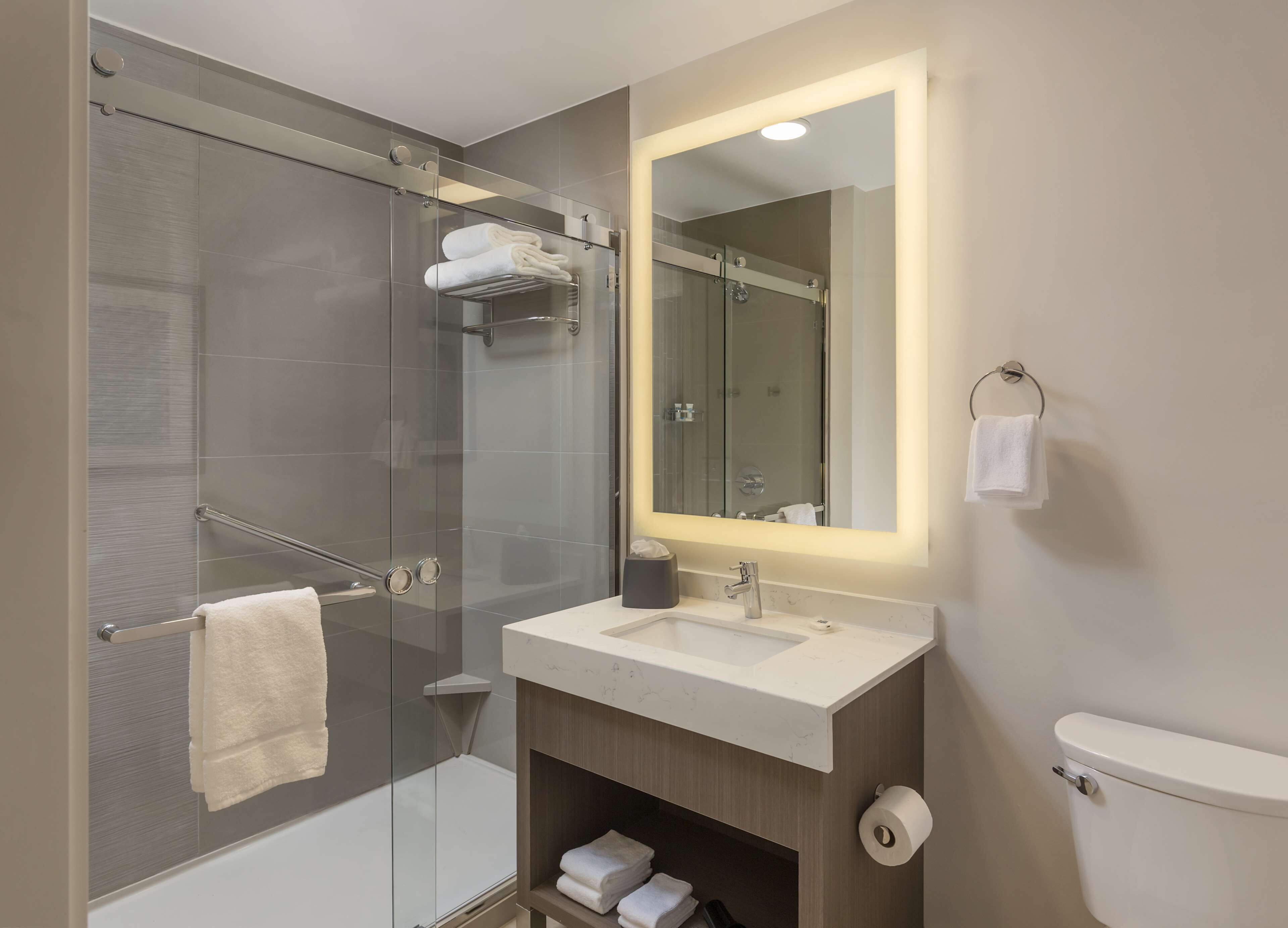 designer toiletries, hair dryer, towels, soap