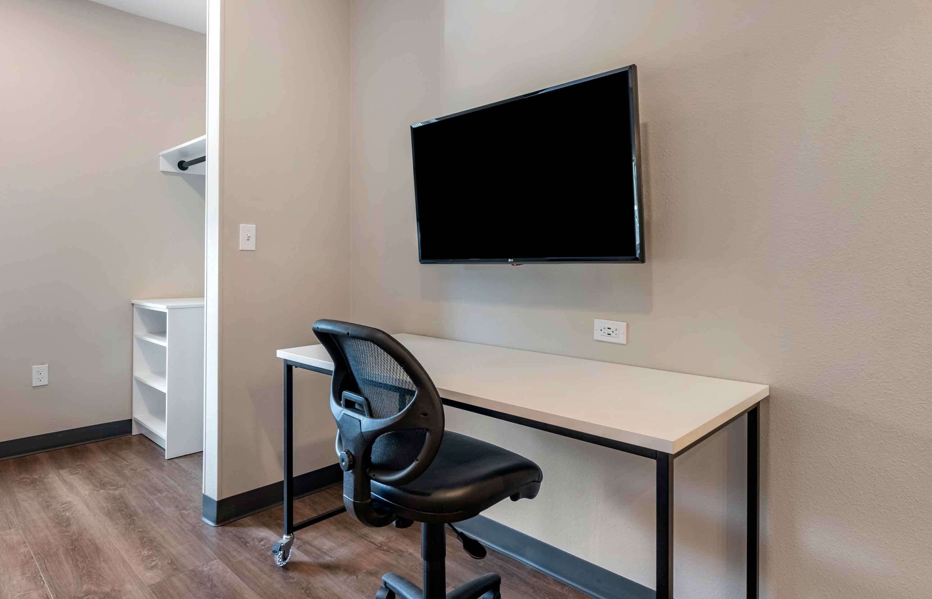 premium bedding, desk, laptop workspace, iron/ironing board