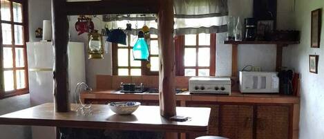 Fridge, microwave, stovetop, coffee/tea maker