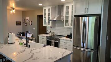 Fridge, dishwasher, cookware/dishes/utensils, dining tables