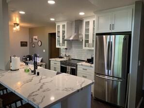 Fridge, dishwasher, cookware/dishes/utensils, dining tables