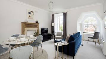 Cozy living space with a fireplace, TV, and comfortable seating area.