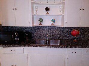 Fridge, microwave, stovetop, coffee/tea maker