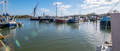 A marina with various boats docked.