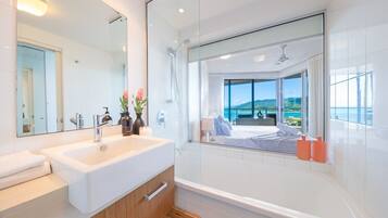 Combined shower/bathtub, hair dryer, towels, toilet paper