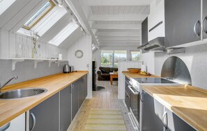 Fridge, stovetop, dishwasher, coffee/tea maker