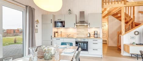 Fridge, stovetop, dishwasher, coffee/tea maker