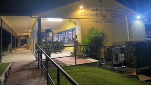 The exterior of the Pacific Palms Bowling Club with a covered walkway leading to the entrance. - The Lake House on Amaroo Waterfront/Free WiFi/Includes Linen, SUP Boards/Kayaks  (Smiths Lake)