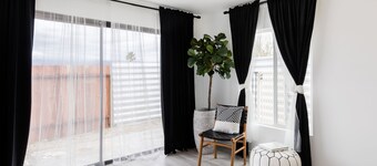 Striking Black & White Apt w Gated Entrance & Yard