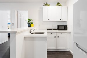 Fridge, microwave, coffee/tea maker, toaster