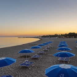 On the beach, free beach cabanas, beach umbrellas, beach towels