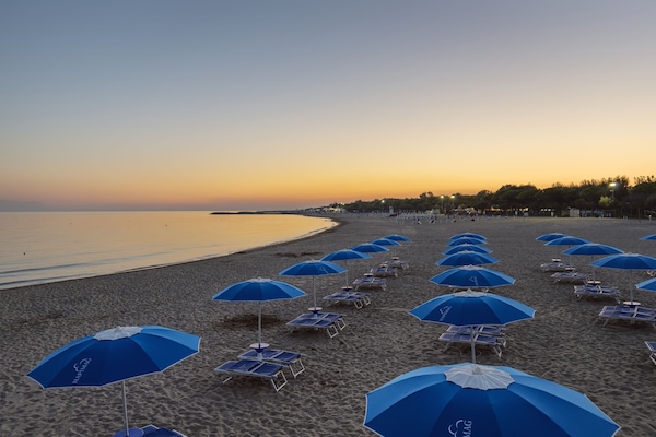 On the beach, free beach cabanas, beach umbrellas, beach towels