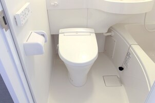 Combined shower/tub, hair dryer, slippers, electronic bidet