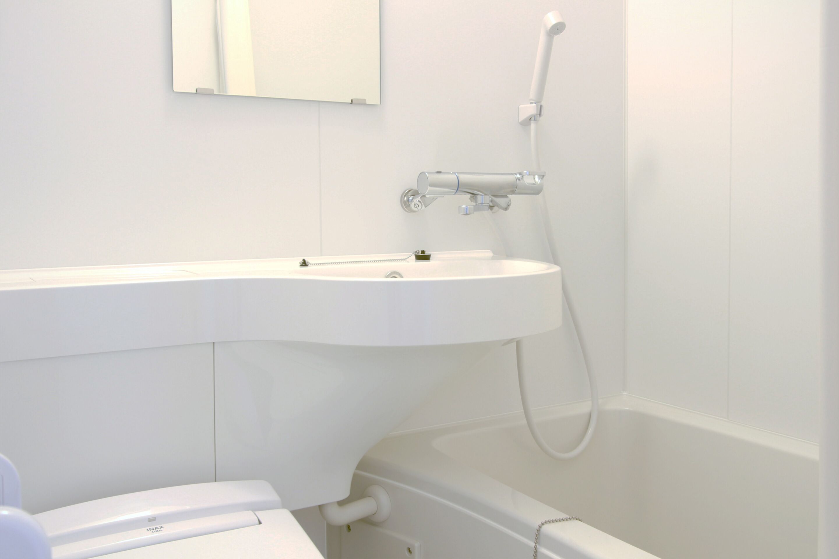 combined shower/bathtub, hair dryer, slippers, electronic bidet