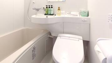 Combined shower/tub, free toiletries, hair dryer, slippers