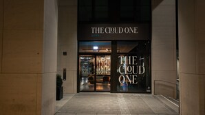 The entrance to The Cloud One Hotel with a modern facade and illuminated signage. - The Cloud One Nürnberg, by the Motel One Group (Nuremberg)